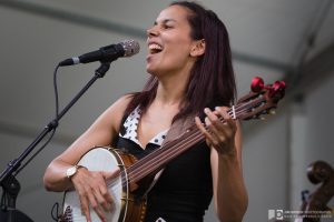 Rhiannon Giddens sings and plays a banjo onstage