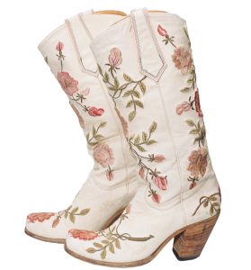 White cowboy boots with pink and green floral embroidery